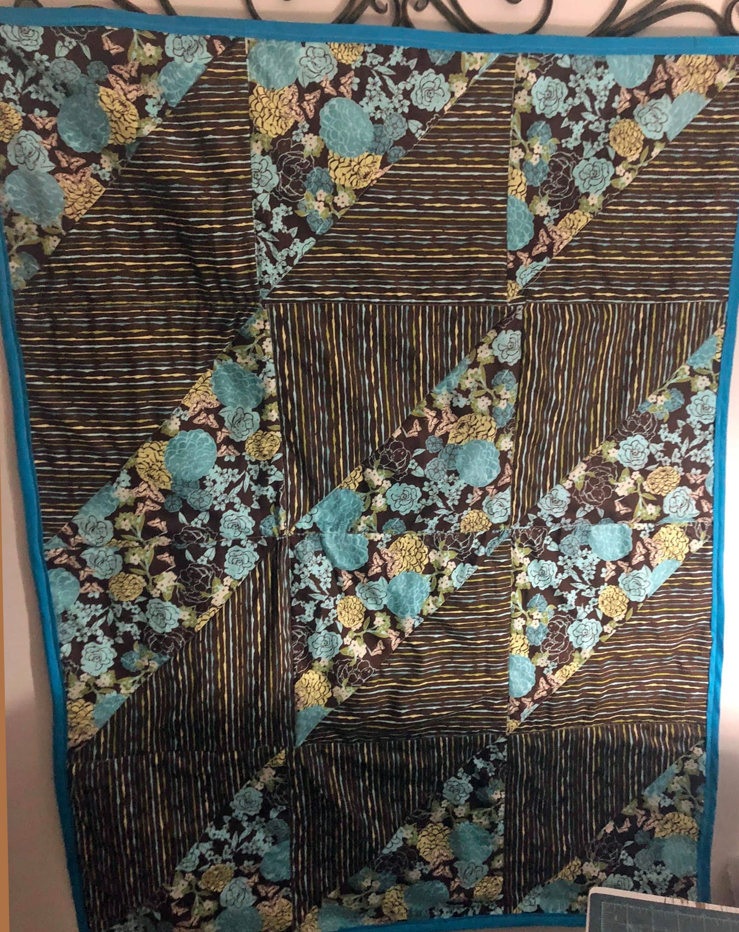 A patterned quilt featuring blue and flowers